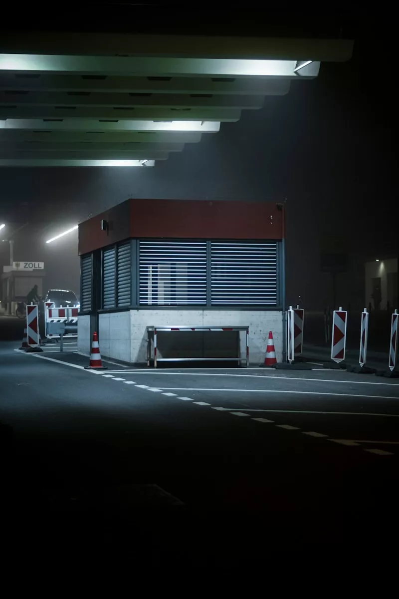 a gas station at night with lights on