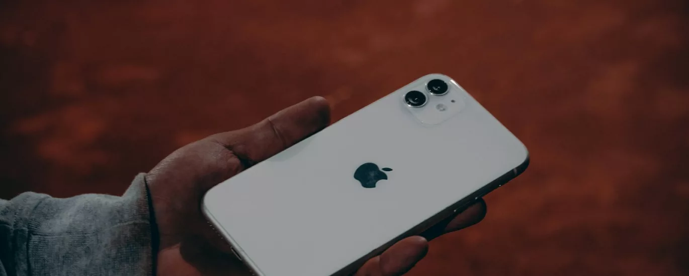 a person holding an iphone in their hand