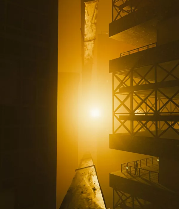A bright light shines between dark architectural structures.