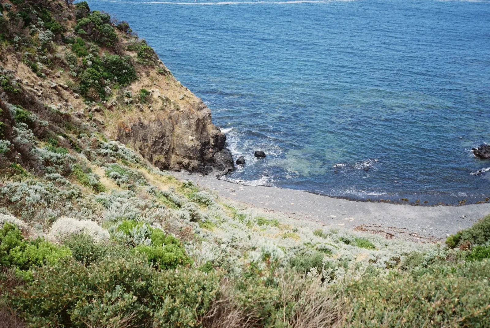 a view of a beach with a boat in the water